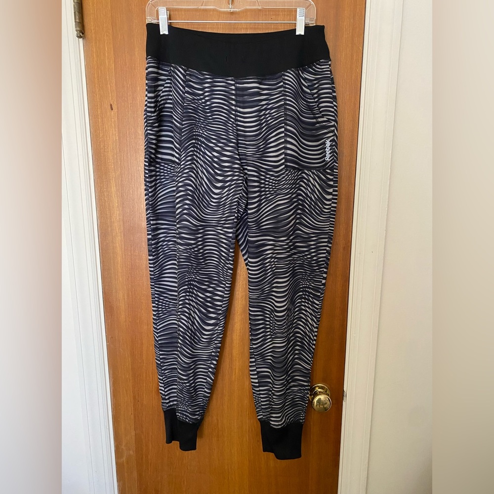 reebok women’s black, and gray joggers. Elastic waist. Cuffed ankles size medium